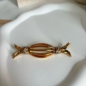 Authentic vintage Nina Ricci gold tone brooch